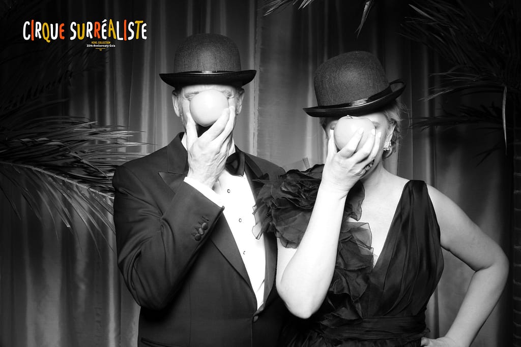 A couple poses with modern art inspired props at the Menil Galleries anniversary gala photo booth