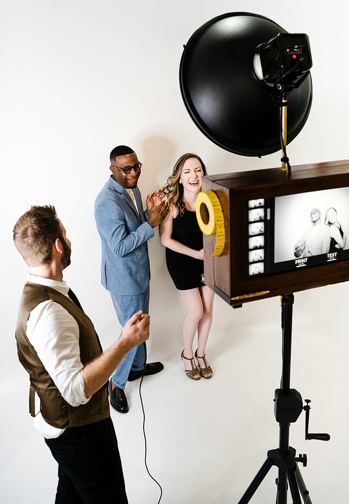 Photo booth couple using vintage inspired houston photo booth rental